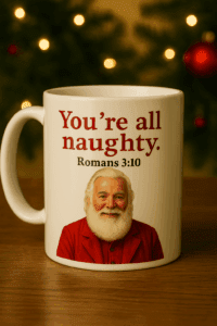 A white ceramic Christmas mug featuring Santa Claus in his traditional red coat without his hat, with the phrase “You’re all naughty. Romans 3:10” printed on the front. The mug is placed in front of a festive holiday background with warm Christmas lights, capturing a humorous moment from Mrs. Claus’s North Pole blog story.